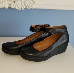 Black leather wedges by Clarks